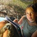 Girl Journal Writing Outside