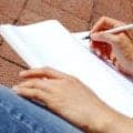 Girl Writing In Note Book